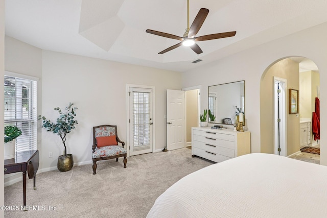 641 Thornwood Ln, Orange Park, FL 32073 - bedroom with multiple windows, arched walkways, light colored carpet, and baseboards