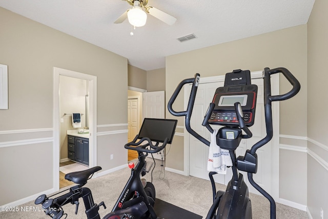 641 Thornwood Ln, Orange Park, FL 32073 - exercise room featuring a ceiling fan, carpet flooring, and baseboards