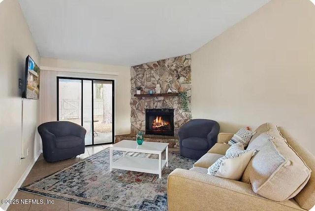 11523 Dunes Way Dr N, Jacksonville, FL 32225 - living room featuring baseboards, a fireplace, tile patterned flooring, and lofted ceiling