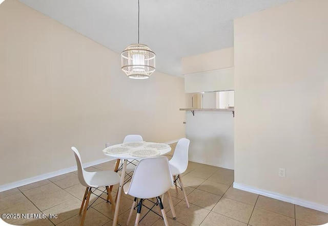11523 Dunes Way Dr N, Jacksonville, FL 32225 - tiled dining space with a chandelier and baseboards