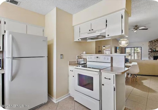 11523 Dunes Way Dr N, Jacksonville, FL 32225 - kitchen with white appliances, under cabinet range hood, light tile patterned floors, a ceiling fan, and a textured ceiling