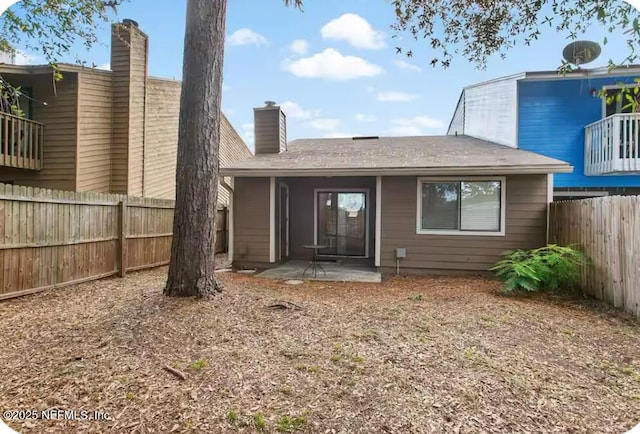 11523 Dunes Way Dr N, Jacksonville, FL 32225 - rear view of house featuring a patio area, a fenced backyard, and a chimney