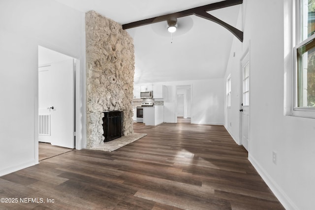 unfurnished living room featuring high vaulted ceiling, a ceiling fan, a fireplace, beamed ceiling, and dark wood-type flooring