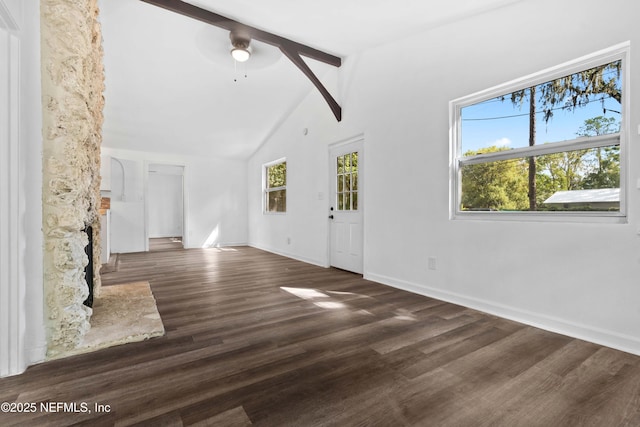 unfurnished living room featuring plenty of natural light, wood finished floors, and ceiling fan