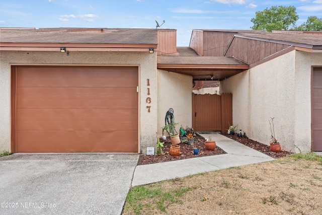 1167 Romaine Cir E, Jacksonville, FL 32225 - view of front of home with driveway, stucco siding, and an attached garage