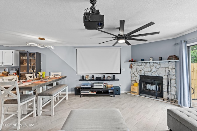 1167 Romaine Cir E, Jacksonville, FL 32225 - living room featuring a textured ceiling, light wood-style floors, ceiling fan, and baseboards