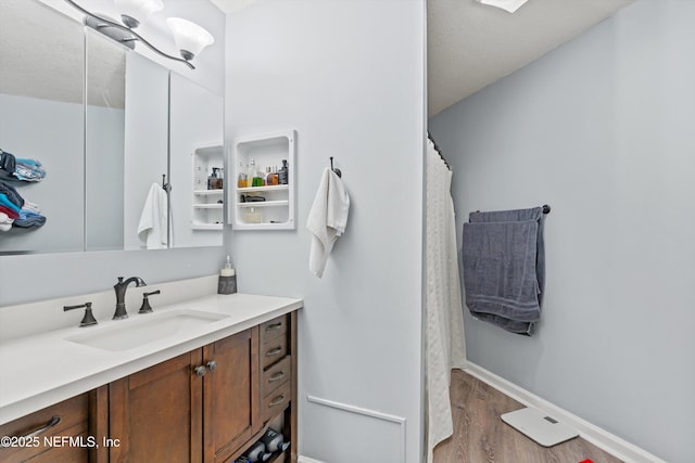 1167 Romaine Cir E, Jacksonville, FL 32225 - full bathroom featuring wood finished floors, vanity, baseboards, and a shower with shower curtain