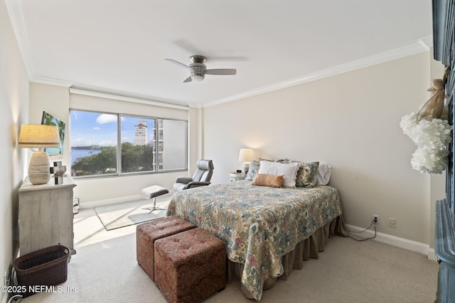 bedroom with carpet flooring, baseboards, ornamental molding, and ceiling fan