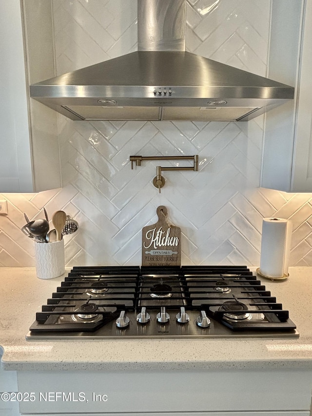 627 Rum Runner Way, Saint Johns, FL 32259 - kitchen view of wall chimney exhaust hood, stainless steel gas stovetop, tasteful backsplash, and pot filler