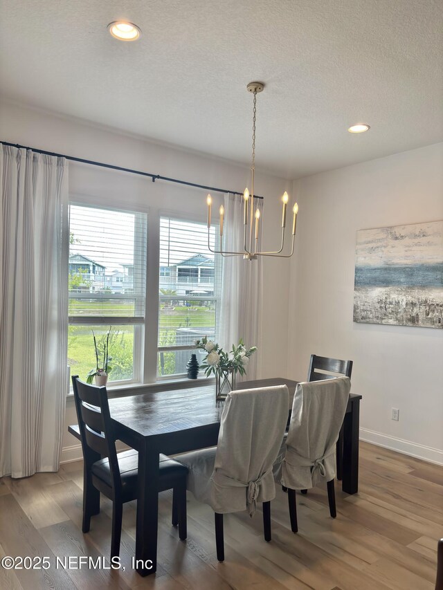 627 Rum Runner Way, Saint Johns, FL 32259 - dining area featuring a chandelier, light wood-style floors, recessed lighting, and a textured ceiling