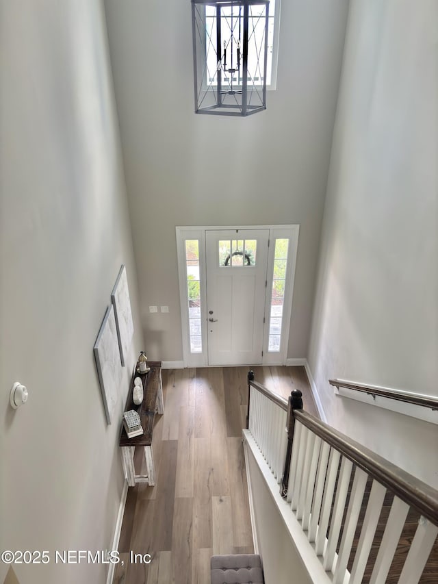 627 Rum Runner Way, Saint Johns, FL 32259 - foyer with a high ceiling, wood finished floors, and a chandelier