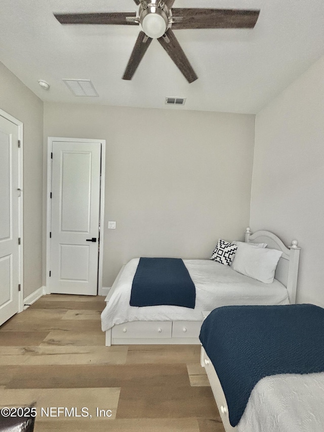627 Rum Runner Way, Saint Johns, FL 32259 - bedroom with wood finished floors and a ceiling fan