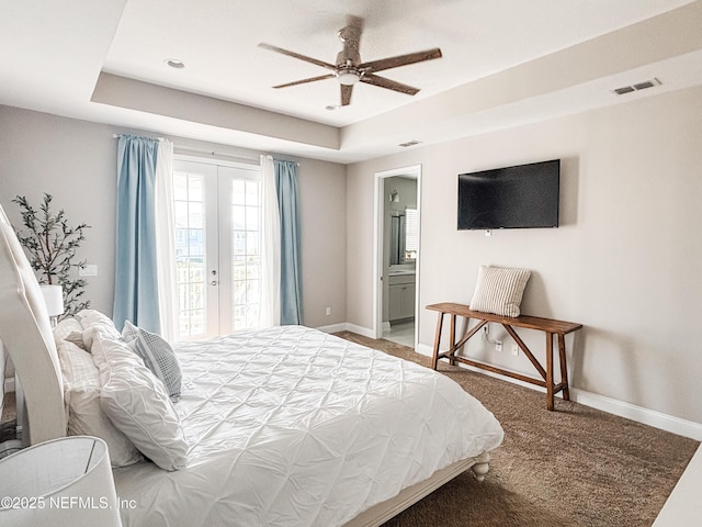 627 Rum Runner Way, Saint Johns, FL 32259 - bedroom featuring a raised ceiling, light colored carpet, access to outside, and connected bathroom