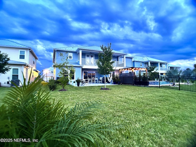 627 Rum Runner Way, Saint Johns, FL 32259 - back of house with a balcony, a patio, a metal roof, and a standing seam roof