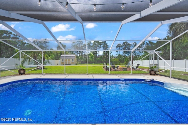 5950 Orchard Pond Dr, Fleming Island, FL 32003 - view of swimming pool featuring a storage shed, an outdoor structure, glass enclosure, and a patio area