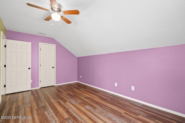 5950 Orchard Pond Dr, Fleming Island, FL 32003 - bonus room with vaulted ceiling, baseboards, ceiling fan, a textured ceiling, and wood finished floors