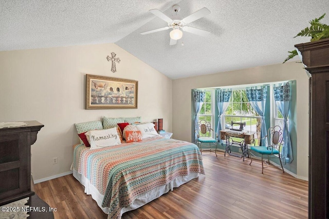 5950 Orchard Pond Dr, Fleming Island, FL 32003 - bedroom with wood finished floors, a textured ceiling, vaulted ceiling, a ceiling fan, and baseboards
