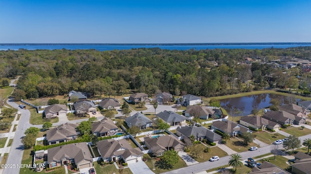 475 Pine Eagle Dr, Fleming Island, FL 32003 - aerial view of property and surrounding area featuring a nearby body of water, a forest, and nearby suburban area