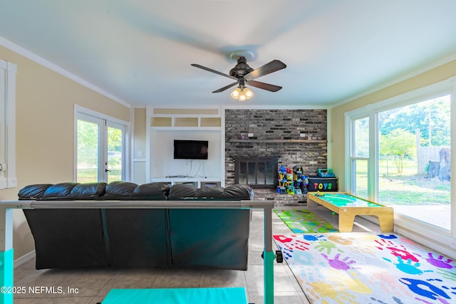 5520 Hyde Grove Ave, Jacksonville, FL 32210 - tiled living room with a ceiling fan, ornamental molding, built in features, and a brick fireplace