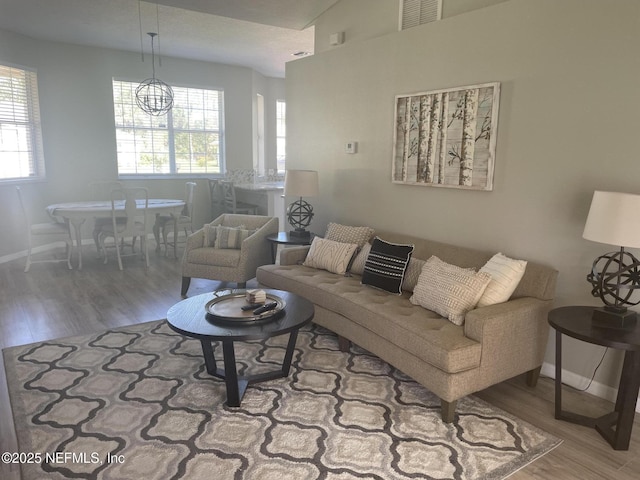living area featuring wood finished floors and baseboards