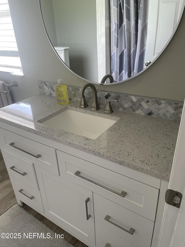 bathroom featuring vanity and wood finished floors