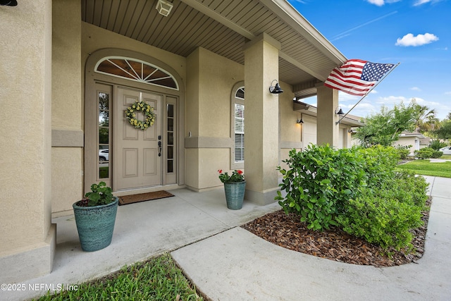 property entrance with stucco siding