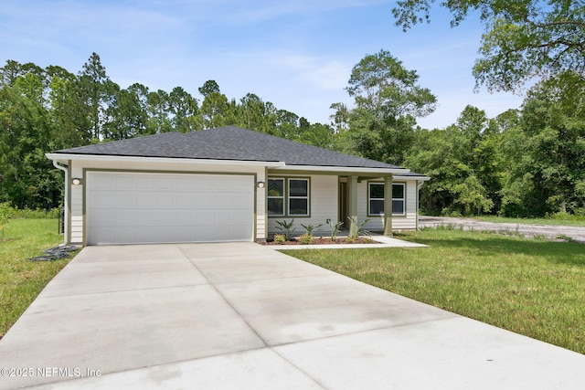 view of front of house featuring concrete driveway, a front lawn, an attached garage, and roof with shingles