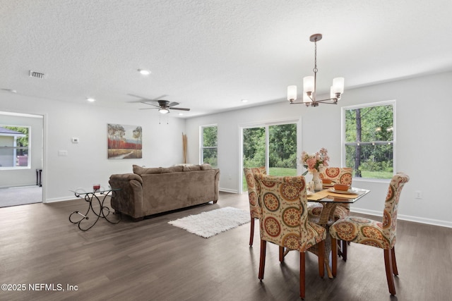 dining room featuring wood finished floors, a chandelier, healthy amount of natural light, baseboards, and recessed lighting