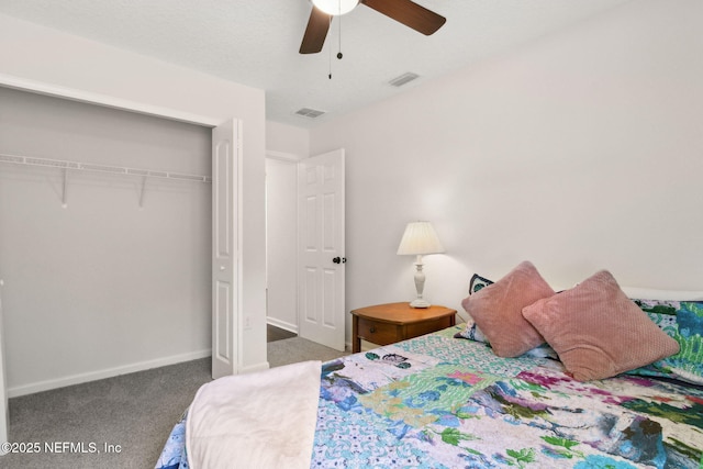 carpeted bedroom with a closet, a ceiling fan, and baseboards