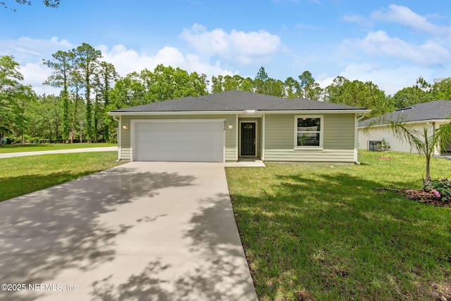 view of front of property with driveway, a front lawn, and a garage