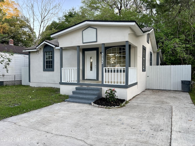 3133 Gilmore St, Jacksonville, FL 32205 - view of front of home featuring covered porch and stucco siding