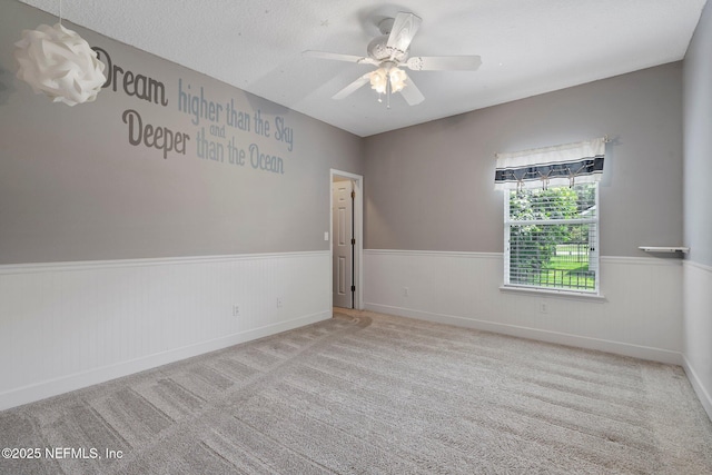 400 N Landguard Rd, Saint Augustine, FL 32092 - carpeted spare room with a wainscoted wall and a ceiling fan