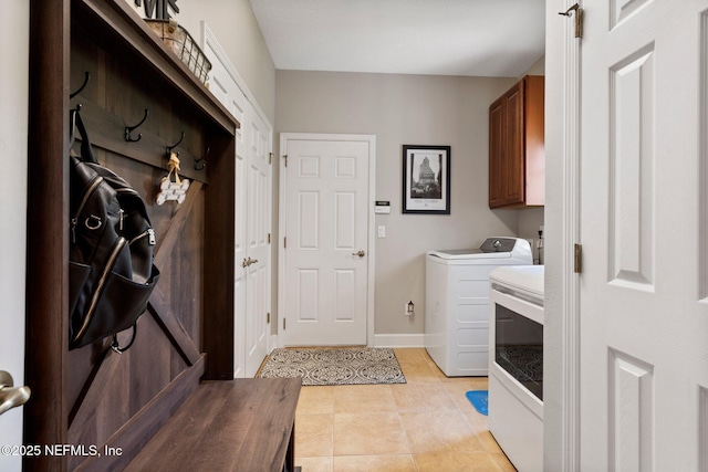 400 N Landguard Rd, Saint Augustine, FL 32092 - laundry area with cabinet space, light tile patterned flooring, and baseboards