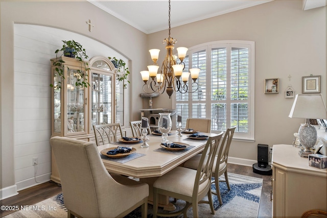 400 N Landguard Rd, Saint Augustine, FL 32092 - dining space with baseboards, ornamental molding, a chandelier, and dark wood finished floors
