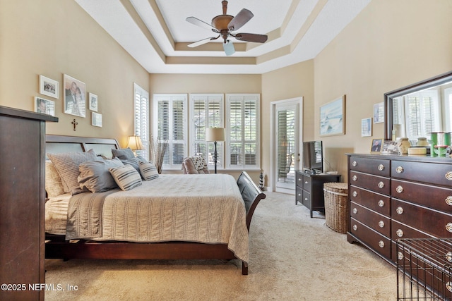 400 N Landguard Rd, Saint Augustine, FL 32092 - bedroom with carpet flooring, multiple windows, a tray ceiling, and a ceiling fan