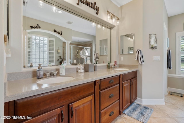 400 N Landguard Rd, Saint Augustine, FL 32092 - full bath with double vanity, ornate columns, a shower stall, and tile patterned flooring