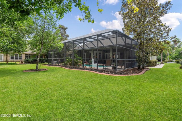 400 N Landguard Rd, Saint Augustine, FL 32092 - rear view of property featuring a yard, an outdoor pool, and glass enclosure