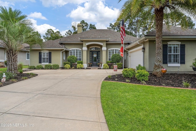 400 N Landguard Rd, Saint Augustine, FL 32092 - view of front of home featuring an attached garage, a chimney, driveway, and stucco siding