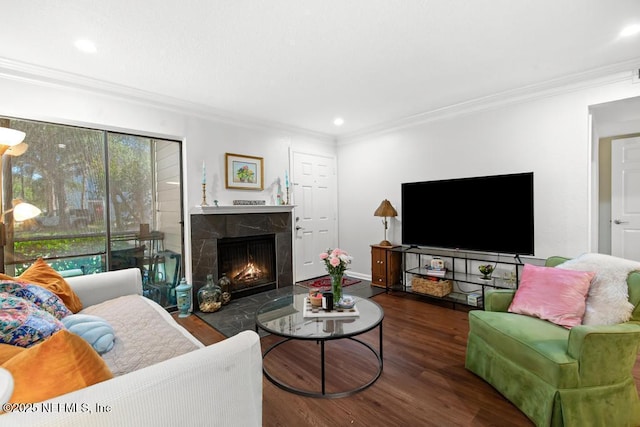 100 Fairway Park Blvd Unit 802, Ponte Vedra, FL 32082 - living room featuring wood finished floors, crown molding, a warm lit fireplace, recessed lighting, and baseboards