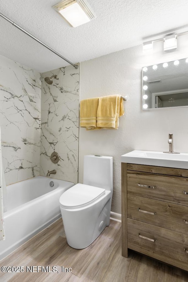 100 Fairway Park Blvd Unit 802, Ponte Vedra, FL 32082 - bathroom with a textured ceiling, wood finished floors, shower / washtub combination, vanity, and toilet