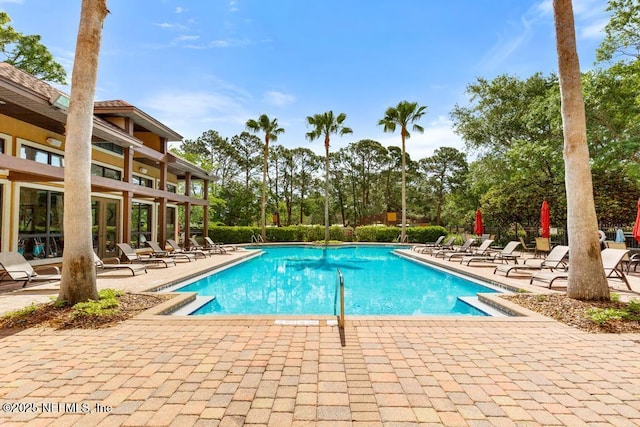 100 Fairway Park Blvd Unit 802, Ponte Vedra, FL 32082 - community pool featuring a patio and view of wooded area