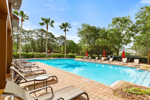 100 Fairway Park Blvd Unit 802, Ponte Vedra, FL 32082 - community pool with a patio area, view of scattered trees, and fence