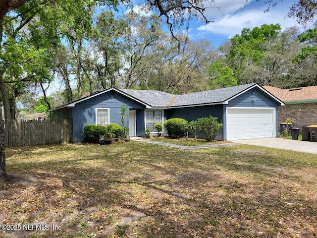 ranch-style home with an attached garage and concrete driveway