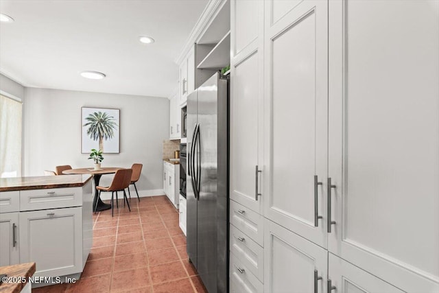 1659 Sea Oats Dr, Atlantic Beach, FL 32233 - kitchen featuring stainless steel refrigerator with ice dispenser, recessed lighting, white cabinets, open shelves, and baseboards