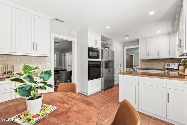 1659 Sea Oats Dr, Atlantic Beach, FL 32233 - kitchen with black appliances, backsplash, open shelves, white cabinets, and recessed lighting