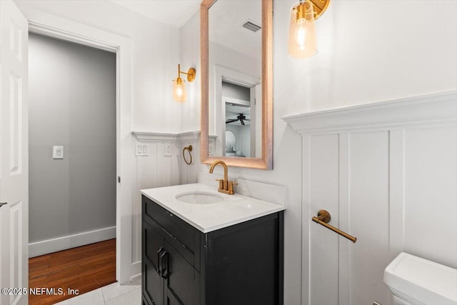 1659 Sea Oats Dr, Atlantic Beach, FL 32233 - bathroom featuring vanity, toilet, ceiling fan, and baseboards
