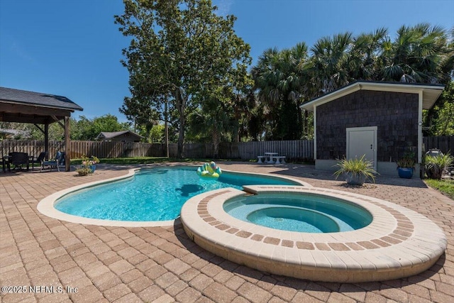 1659 Sea Oats Dr, Atlantic Beach, FL 32233 - view of pool with a patio area, a fenced backyard, a pool with connected hot tub, and an outbuilding