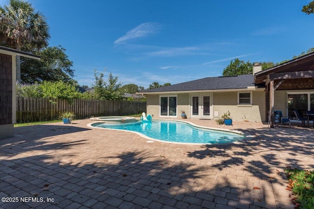 1659 Sea Oats Dr, Atlantic Beach, FL 32233 - view of swimming pool with french doors, a patio, a fenced backyard, and a pool with connected hot tub