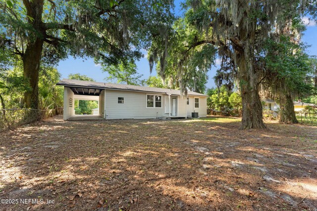 855 Cornwallis Dr, Jacksonville, FL 32208 - back of property with fence and central AC unit
