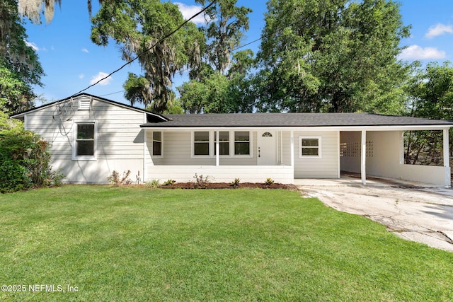 855 Cornwallis Dr, Jacksonville, FL 32208 - ranch-style home with a front yard, a carport, and driveway